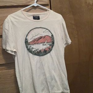 Graphic Cream Colored T Shirt.